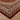 Decorative rug with intricate patterns on a wooden floor