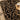 Decorative black and gold patterned rug with a wooden stool and candle.