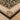 Decorative rug with intricate patterns on a wooden floor