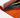 Colourful rug edge showing orange and red design