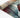 Tiffany Autumn Leaf Modern Rug rolled view in multi-colour red, blue, and green design