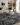 Monarch designer wool rug in charcoal grey with raised wing-inspired pattern and textured wool finish
