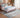 Bluehaven Ocean Blue & Mustard distressed rug styled in a bedroom