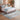 Bluehaven Ocean Blue & Mustard distressed rug styled in a bedroom