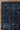 Dark blue patterned rug on a wooden floor