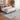Bluehaven Light Grey distressed rug styled in a modern bedroom