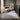 Bluehaven Light Grey distressed transitional rug styled in a neutral living room