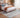 Bluehaven Grey distressed rug styled in a modern bedroom