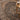 Patterned rug with a wooden stool and candle on a light background