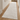 Light cream textured hallway runner in a bright interior