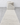 Plush light-coloured hallway runner extending from a roll