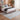 Bluehaven Light Grey distressed rug styled in a modern bedroom