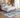 Bluehaven Blue Grey distressed rug styled in a modern bedroom