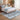 Bluehaven Blue Grey distressed rug styled in a modern bedroom