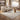 Mocha brown area rug styled with neutral living room furniture