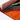 Colourful rug edge showing orange and red design