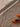 Orange shoes on a textured brown and beige carpet