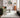Logan Ivory Border Classic Rug styled in a contemporary living room