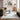 Logan Ivory Heritage Border Rug styled in a contemporary living room