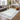 Logan Silver Border Classic Rug styled in an elegant interior