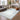 Logan Silver Heritage Border Rug styled in an elegant interior