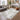 Logan Soft Mist Abstract Rug styled in an elegant neutral interior