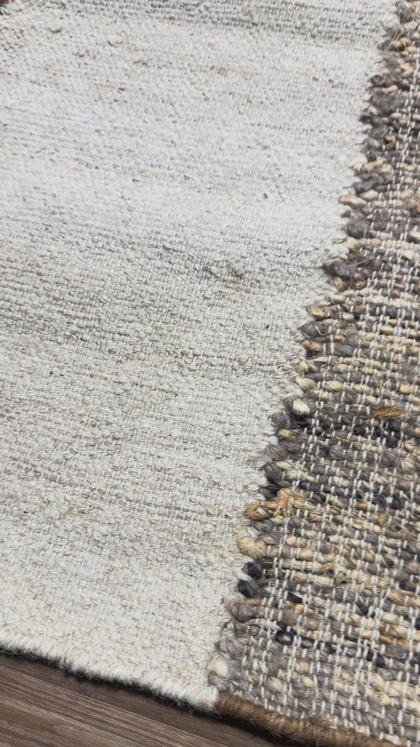 Rug photographed in natural store lighting to show true colour and texture.