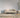 Wool Braid Luxe Beige Wool Rug with textured loop weave on white background