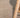 Close-up of a textured beige rug with a wooden chair leg partially visible.