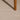 Close-up of a textured ivory rug with a wooden leg partially visible